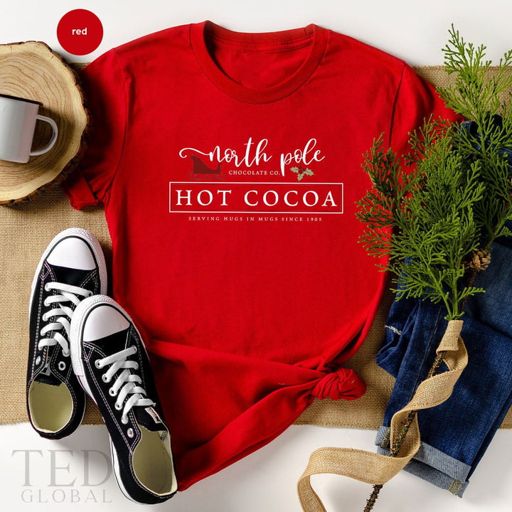 Cute North Pole Hot Cocoa T-Shirt, Funny Chocolate T Shirt, Shirts, Family Christmas Shirt, Serving Hugs In Mugs TShirt, Gift For Christmas